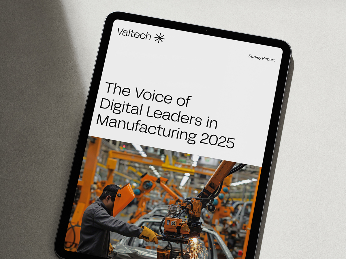 Tablet showing Valtech survey report: The Voice of Digital Leaders in Manufacturing, robotic arm.