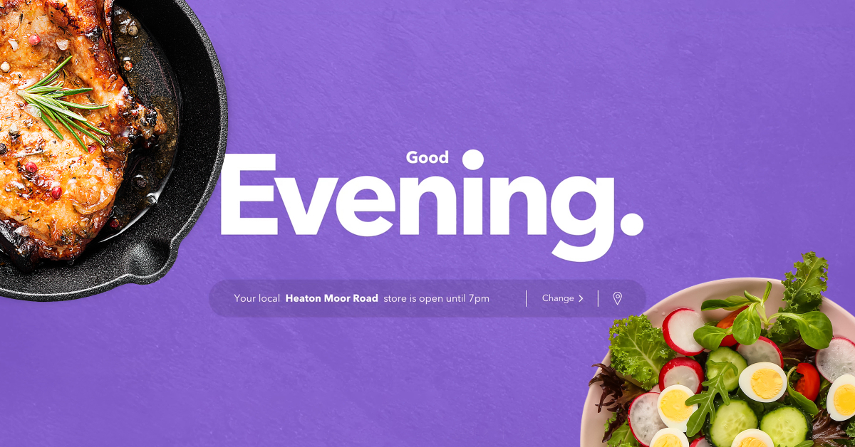 A vibrant image with a purple background featuring the text 'Good Evening.' On the left side is a skillet with a perfectly cooked, seasoned meat dish, and on the right is a fresh salad with sliced vegetables and boiled eggs. Below the text, there is a message indicating that the local Heaton Moor Road store is open until 7 pm, with an option to change the location