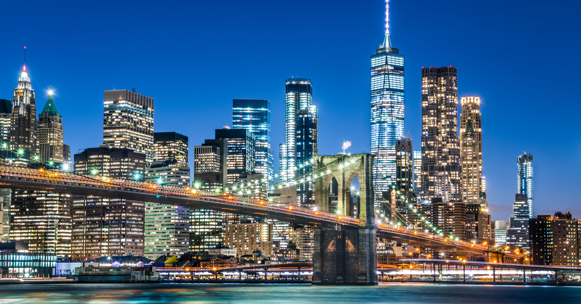 New York City Skyline with Brooklyn Bridge at Night